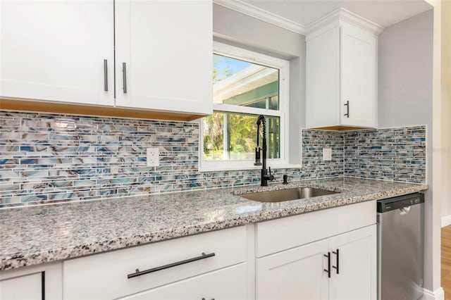 kitchen featuring white cabinets, light stone countertops, sink, and dishwasher