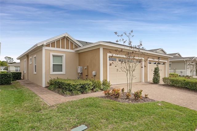 single story home with a front lawn and a garage