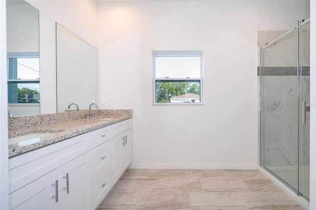 bathroom with an enclosed shower, double vanity, and tile flooring