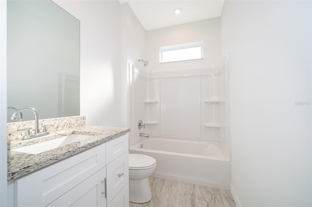 full bathroom with tile flooring, washtub / shower combination, vanity, and toilet