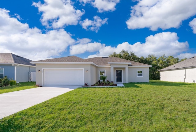 view of front of house featuring a front yard and a garage