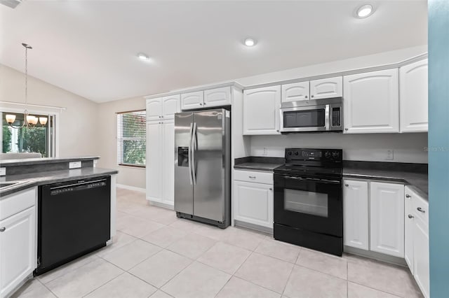 kitchen with pendant lighting, white cabinetry, black appliances, light tile floors, and lofted ceiling