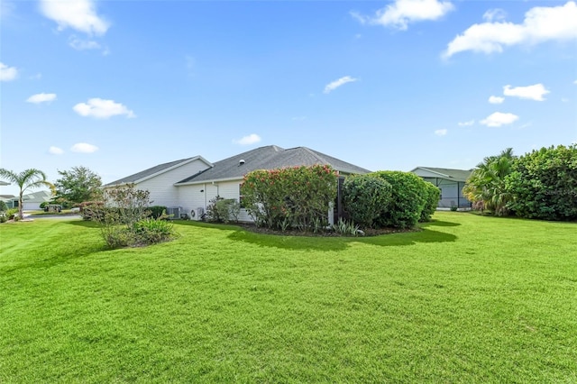 view of yard featuring a lanai