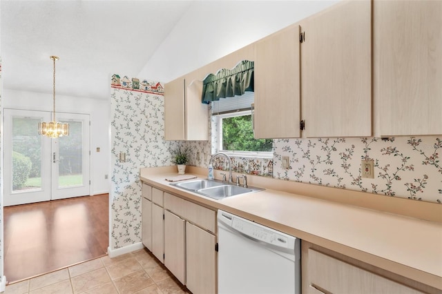 kitchen featuring sink, pendant lighting, light brown cabinets, a notable chandelier, and dishwasher