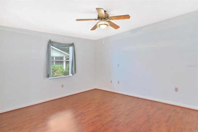 spare room with wood-type flooring