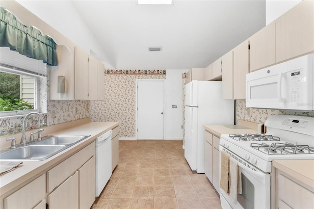 kitchen featuring sink and white appliances