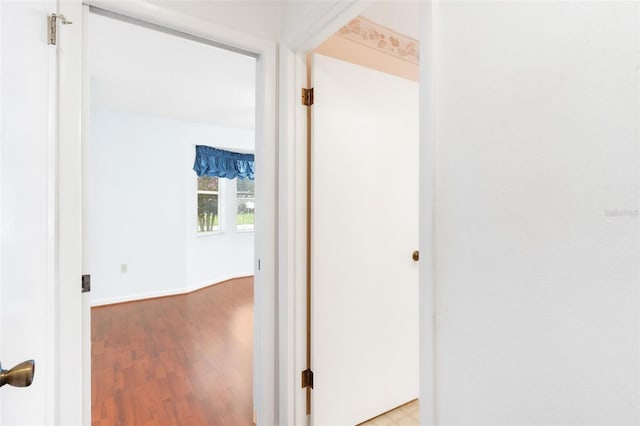 hall with light hardwood / wood-style floors