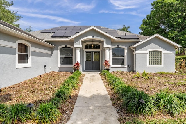 view of front of home with solar panels