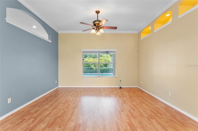 unfurnished room with light hardwood / wood-style flooring, ceiling fan, and ornamental molding