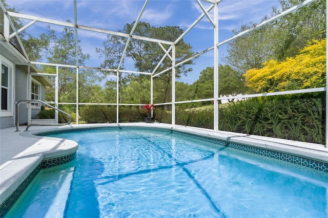 view of pool with a lanai