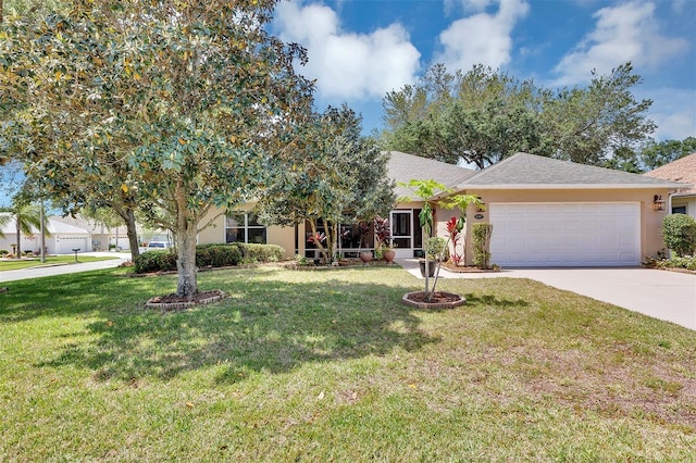 view of front facade with a front yard and a garage