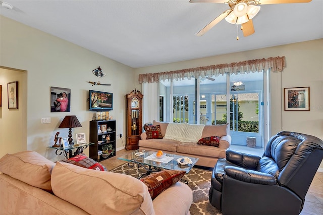 tiled living room featuring ceiling fan