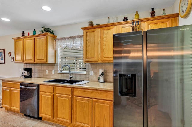 kitchen featuring black dishwasher, stainless steel refrigerator with ice dispenser, tasteful backsplash, sink, and light tile floors