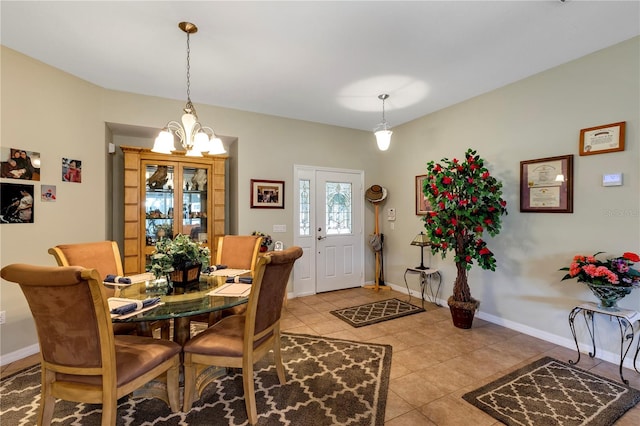 tiled dining space with an inviting chandelier