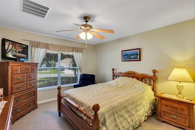 bedroom with light colored carpet and ceiling fan