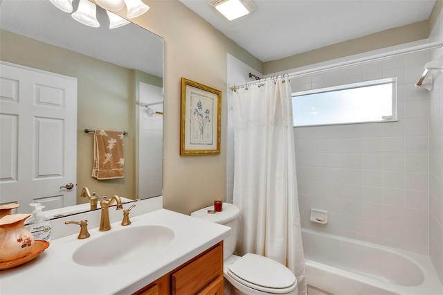 full bathroom with shower / tub combo with curtain, vanity, and toilet