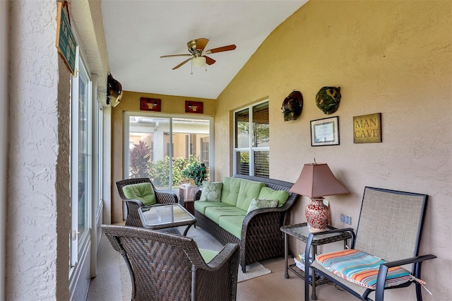 sunroom with lofted ceiling and ceiling fan