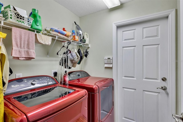 washroom with washer and dryer, electric dryer hookup, and a textured ceiling