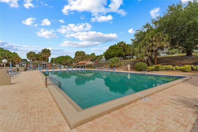 view of swimming pool with a patio area