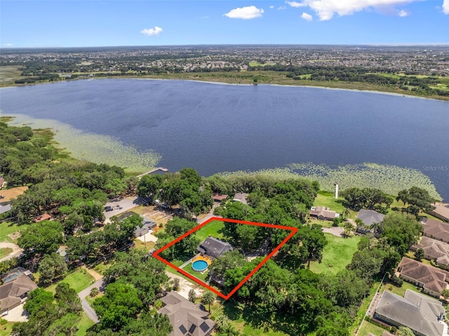 birds eye view of property with a water view