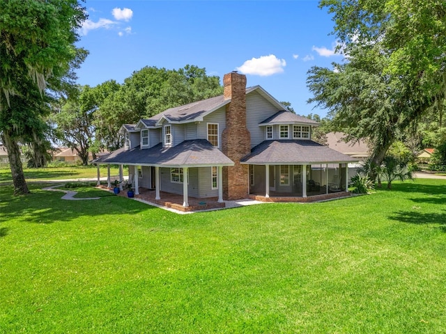 back of house with a lawn