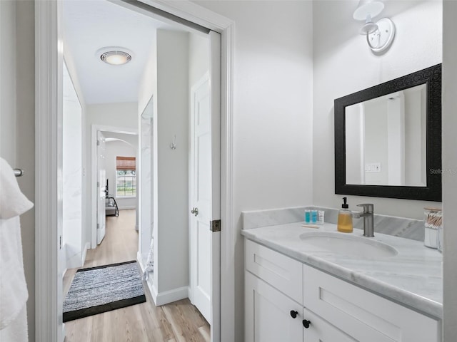 bathroom featuring vanity and hardwood / wood-style flooring