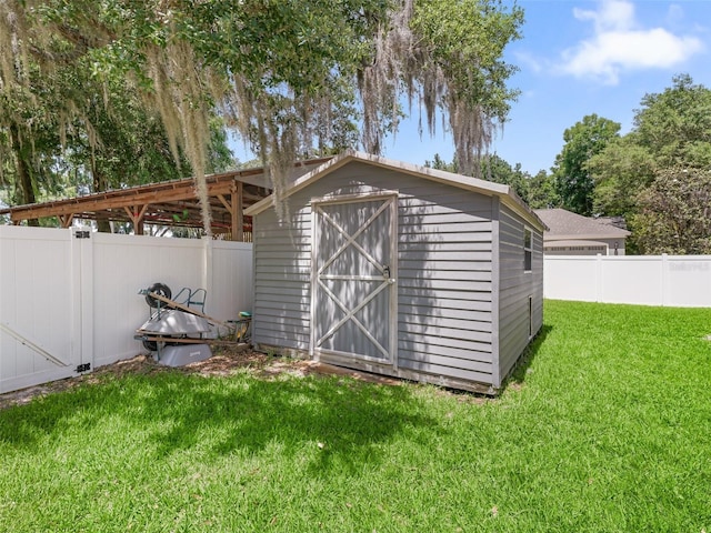 view of outdoor structure featuring a lawn