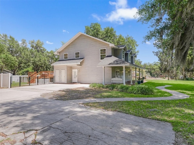 view of front property with a front yard and a porch