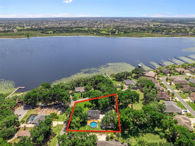 birds eye view of property with a water view