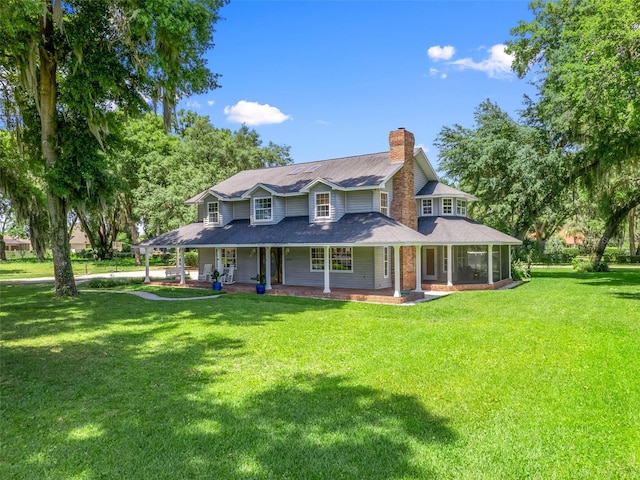 rear view of house with a yard