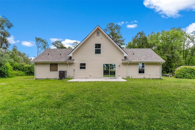 back of property with a patio, central air condition unit, and a lawn