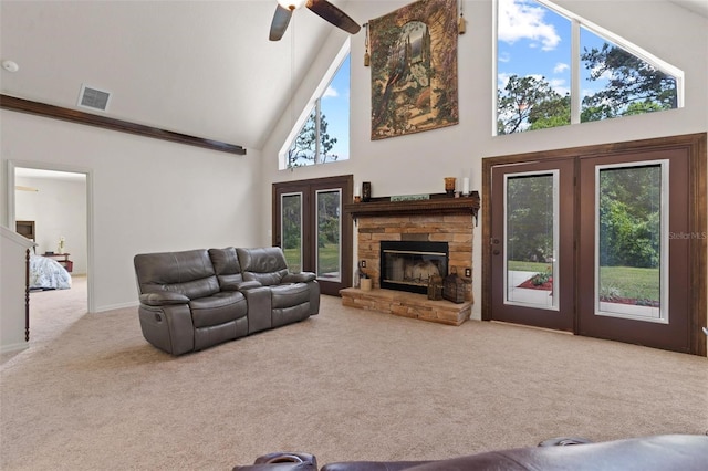 living room featuring a fireplace, high vaulted ceiling, ceiling fan, and carpet floors