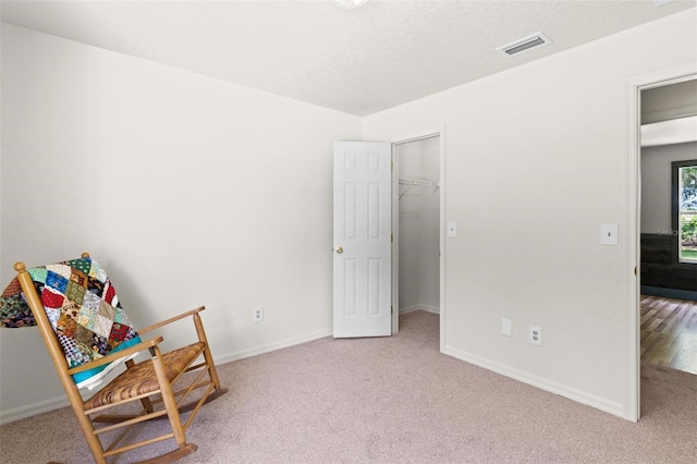 living area featuring carpet floors