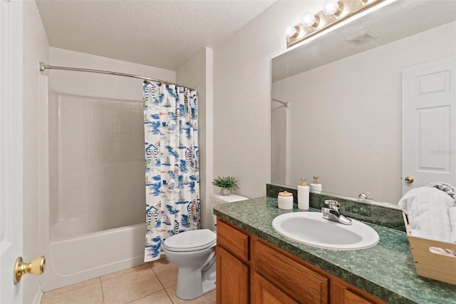 full bathroom with tile flooring, large vanity, shower / bath combo with shower curtain, a textured ceiling, and toilet