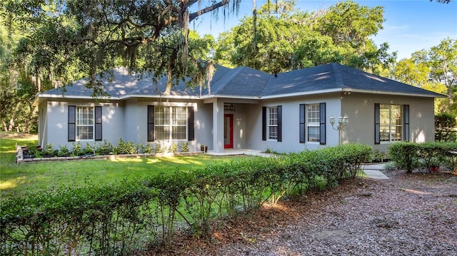 ranch-style home with a front yard