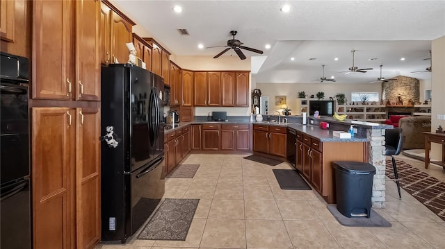 23321 N Buckhill Rd, Howey In The Hills, FL 34737 - kitchen featuring black appliances, a ceiling fan, open floor plan, a peninsula, and light tile patterned flooring