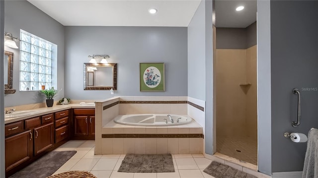 23321 N Buckhill Rd, Howey In The Hills, FL 34737 - bathroom featuring double vanity, a garden tub, tile patterned flooring, and a shower