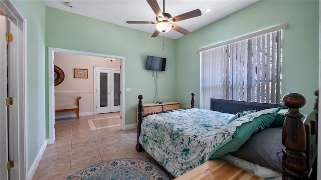 23321 N Buckhill Rd, Howey In The Hills, FL 34737 - bedroom with tile patterned floors, french doors, and a ceiling fan