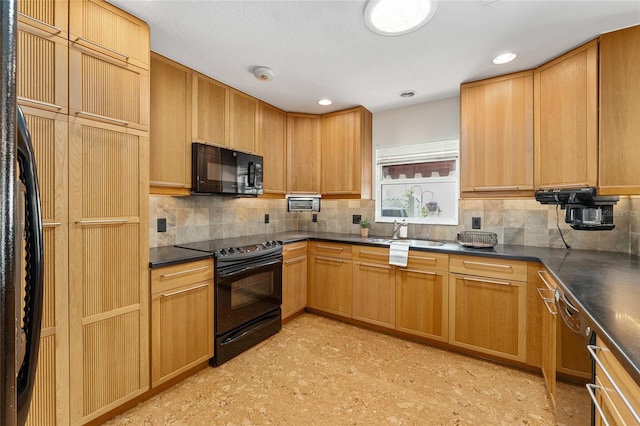 kitchen with black appliances, sink, and backsplash