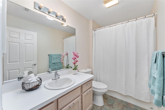 bathroom featuring tile flooring, oversized vanity, and toilet