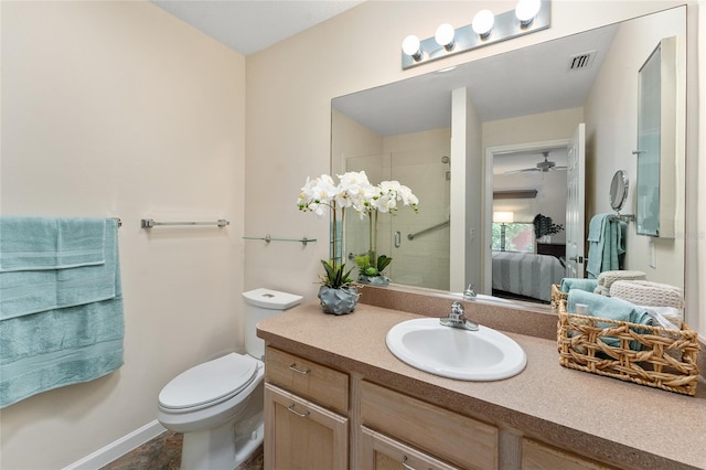 bathroom with ceiling fan, oversized vanity, tile flooring, and toilet