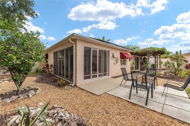 rear view of house with a patio