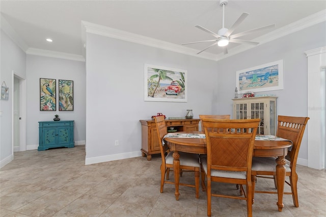 dining space featuring ceiling fan and ornamental molding