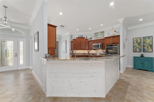 kitchen with hanging light fixtures, light stone countertops, crown molding, and stainless steel appliances