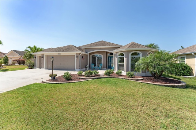 view of front of house with a front yard and a garage