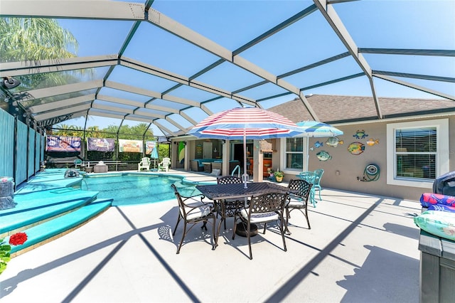 view of pool with a lanai and a patio