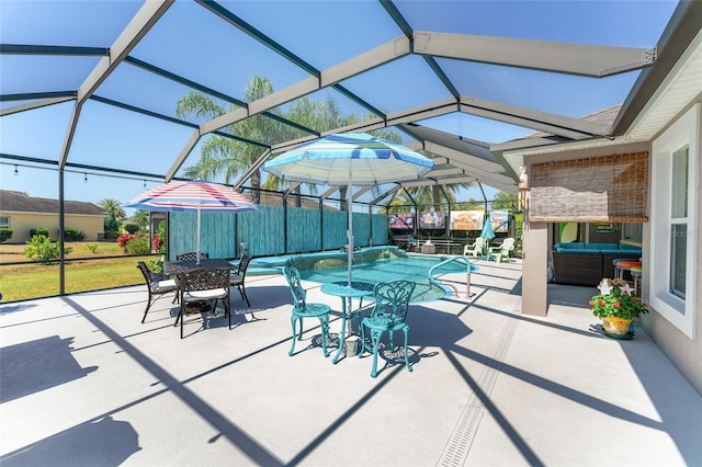 view of patio / terrace with outdoor lounge area and glass enclosure