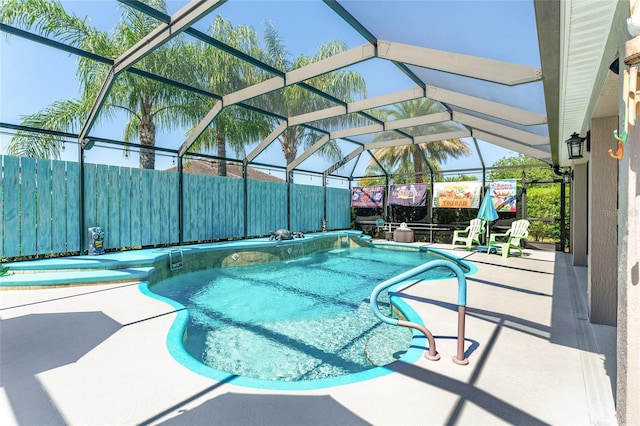 view of pool featuring a lanai, a jacuzzi, and a patio