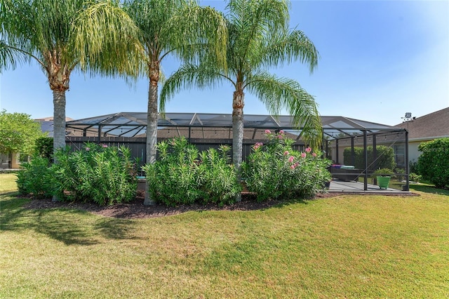 view of yard featuring glass enclosure