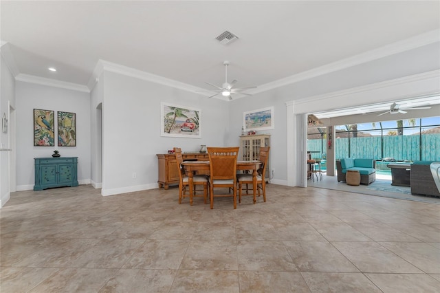 dining area featuring ceiling fan, ornamental molding, and light tile patterned flooring